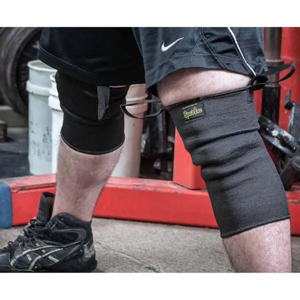 Wearing Spud Knee Sleeves 1 Ply, one appears primed for action, with their durable design offering excellent support and protection.