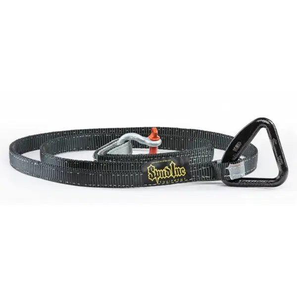 The Spud Inc Sled Attachment Strap, black with a yellow embroidered logo on the webbing, features a triangular carabiner at its end and is coiled in a circle.