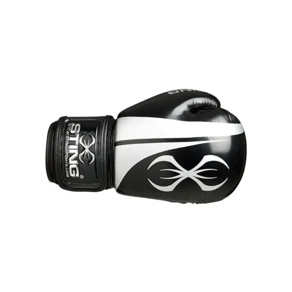 The Sting Armalite Boxing Gloves feature a black and white design with a symmetrical white pattern and STING printed on the wrist strap.