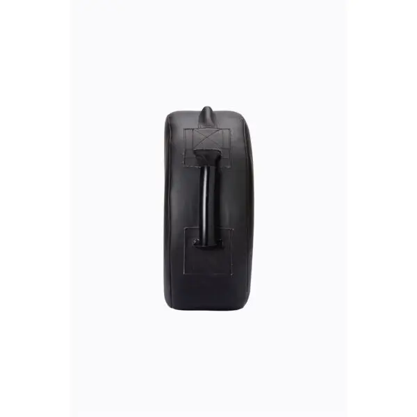 The Sting Round HD Strike Shield is a black leather punching pad featuring a side view and a central sturdy handle for grip. Its design showcases visible stitching, ensuring durability and functionality for martial arts or boxing training.