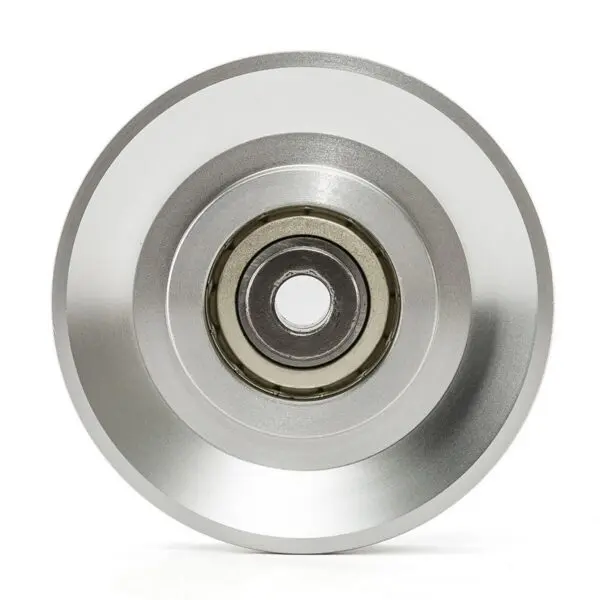 Close-up of a shiny, silver-toned Aluminium Pulley Wheel 115mm with concentric grooves. The darker center reveals the internal mechanism against a plain background.