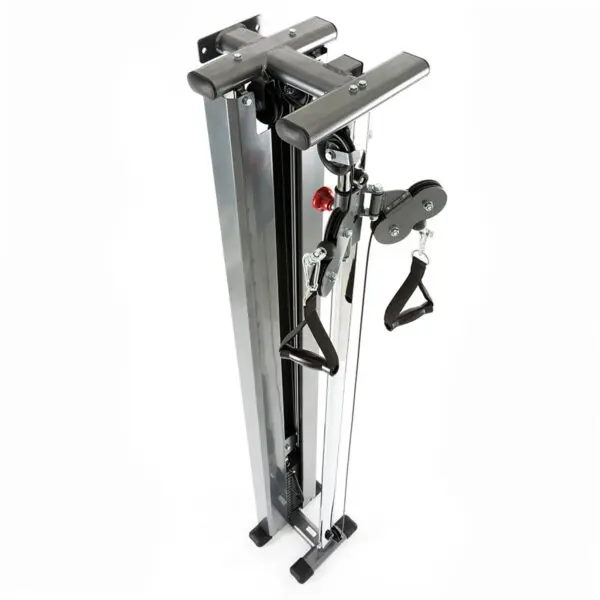A folded home gym cable crossover machine with a compact, vertical design. This wall-mounted cable machine features pulleys, handles, and a sturdy metal frame, ideal for space-saving indoor workout setups.