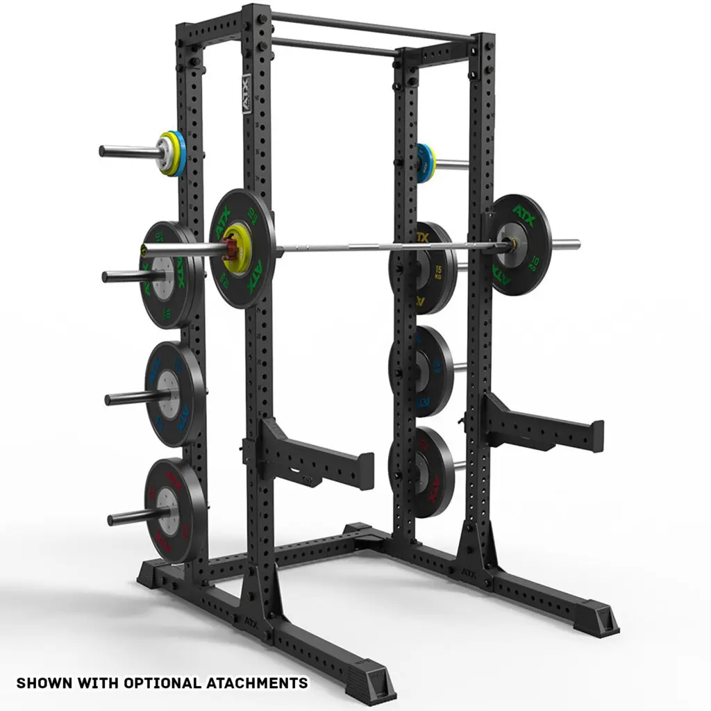 The ATX® Half Rack 810 is a heavy-duty black squat rack featuring multiple weight plates on each side. It includes a barbell and offers various attachment options. Text at the bottom reads SHOWN WITH OPTIONAL ATTACHMENTS.
