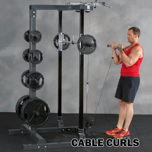 A person in a red tank top and black shorts performs cable curls with the Ironmaster IM2000 Self-Spotting Smith Machine in a gym. Text at the bottom reads CABLE CURLS.