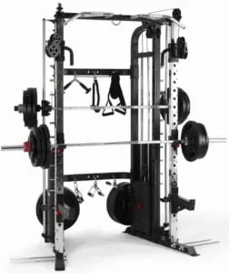 A weightlifting machine equipped with multiple bars, pulleys, and weights. It features a smith machine barbell and various attachments, suitable for a full-body workout. The setup includes weight plates on a rack for training versatility.