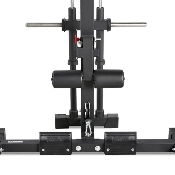 Close-up of a black ATX® Half Rack workout machine featuring padded rollers, footholds, and metal bars. Designed for lower body exercises like targeting hamstrings and glutes, with a red adjustment knob visible on the side.
