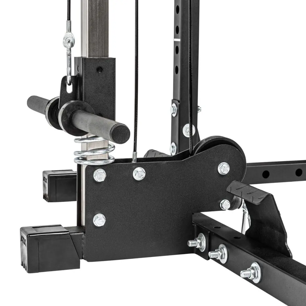 Close-up of the ATX® Lat Option 510 195cm, a home gym cable pulley system featuring black metal components, cables, and screws for adjusting equipment designed for strength training exercises.