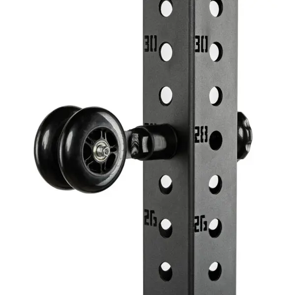 Close-up of the ATX® Mobility Roller, featuring a black, minimalist pulley system with two wheels attached to a metal frame. The vertical column has numbered holes for adjustable heights, and numbers 26, 28, and 30 are visible.
