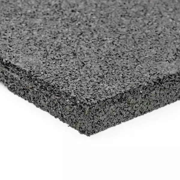 Close-up of the GymFloor RTS 50x50@20mm System, featuring its textured black rubber surface and thickness. The mat is shown on a white background, emphasizing its rugged material and slightly rough edges.