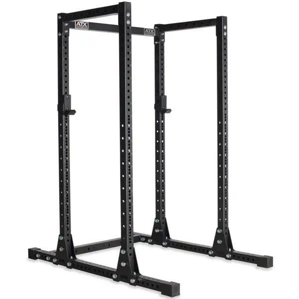 The ATX® Power Rack 755 Short Distance is a black metal power rack for weightlifting with adjustable attachments and multiple holes for customization, designed for home or gym use.