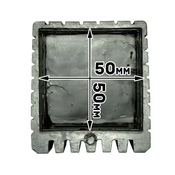 The Rubber Foot 50mmx50mm is a metallic mold with serrated edges on three sides, a bottom protrusion, and an interior measurement of 50mm x 50mm. The inner surface is textured and unfinished.