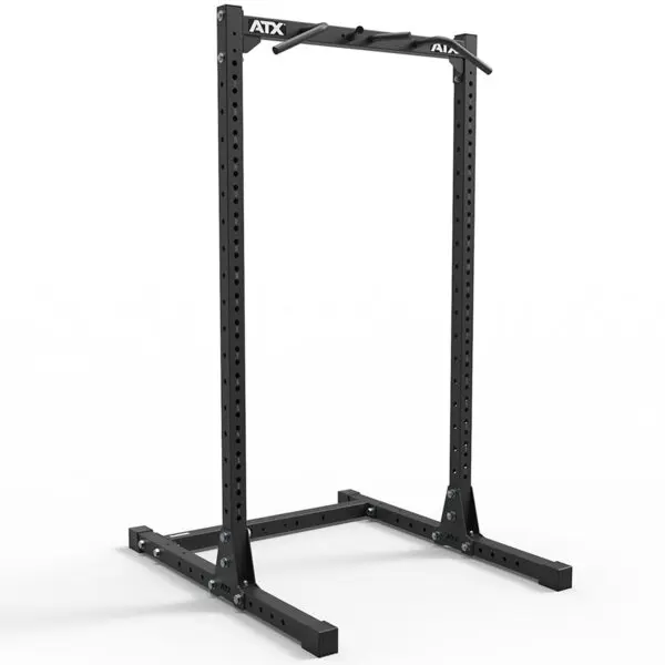 A freestanding black metal ATX® Half Rack 750 features adjustable holes for weightlifting and a pull-up bar at the top, with ATX visible on the header bar, set against a white background.