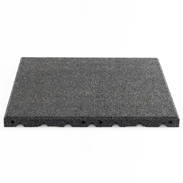 The Shock & Sound Tile 30mm System is a gray rectangular foam or rubber mat with a textured, flat top and uneven edge, set against a white background. It features grooved patterns on the bottom edge for potential cushioning or anti-slip benefits.