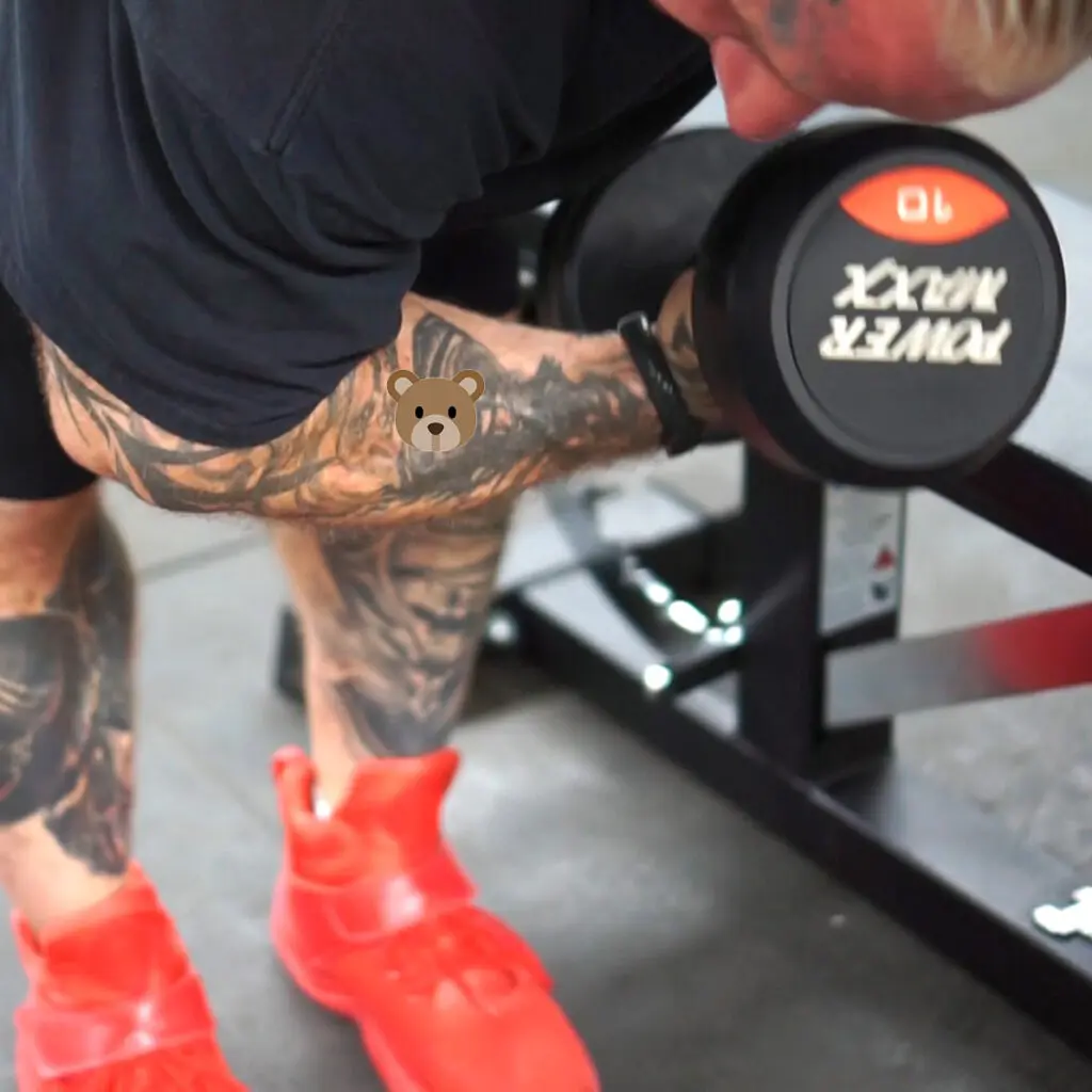 Lee Priest doing a concentration curl.