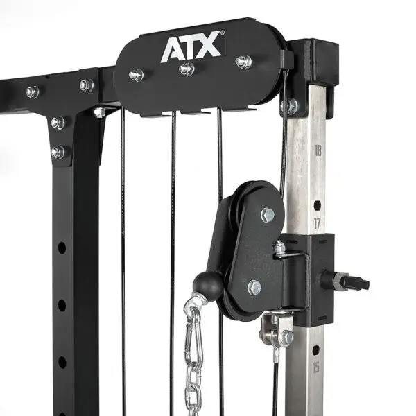 Close-up of a black ATX® Cable Crossover Weight Stack 90 kg on a gym machine. The image showcases metal components, bolts, and a chain, highlighting its sturdy construction and detailing.