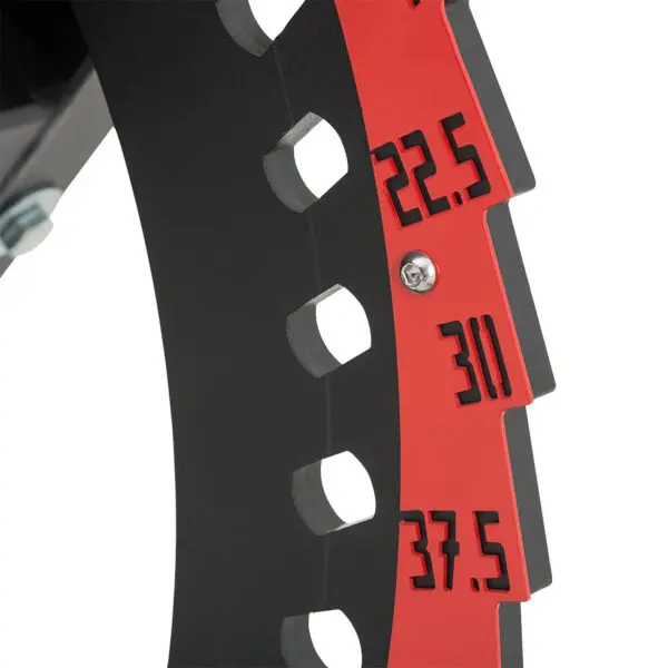 Close-up of the ATX® Utility Bulls Bench featuring a black circular tool with red numbering for sizes 22.5, 30, and 37.5 against a black background, along with evenly spaced cut-out sections.