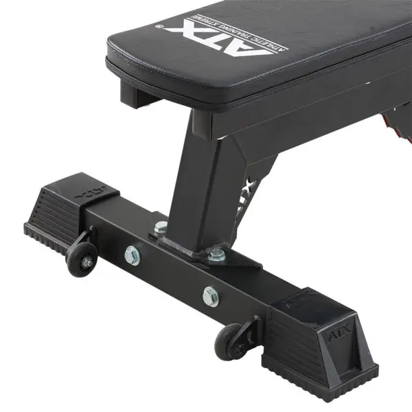 Close-up of the ATX® Utility Bulls Bench, featuring a sturdy black metal frame, rubber-padded feet, two small caster wheels, and a leather-covered seat with the brand logo visible on it.