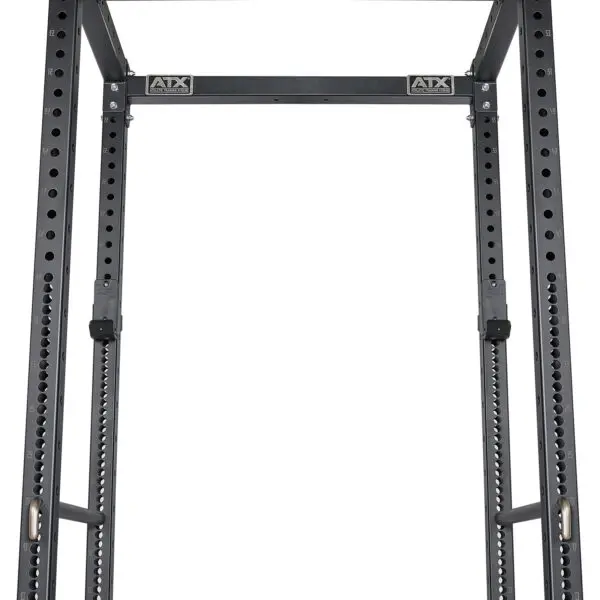 A close-up of the ATX® Power Rack 755 Short Distance for weightlifting shows its metal frame with multiple barbell adjustment holes and logos on the top crossbar, set against a plain white background.