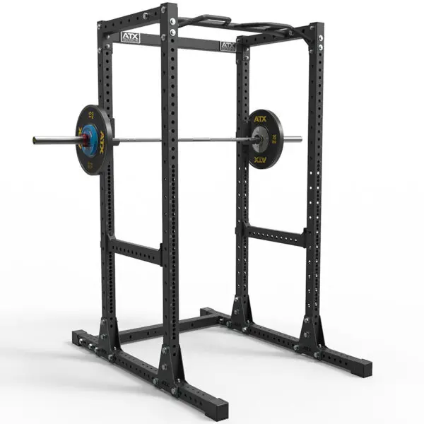 The ATX® Power Rack 755 Short Distance, a sturdy black rack, includes a barbell and weight plates. It features safety bars and multiple adjustment holes for versatile training. The robust design stands out against the white background.