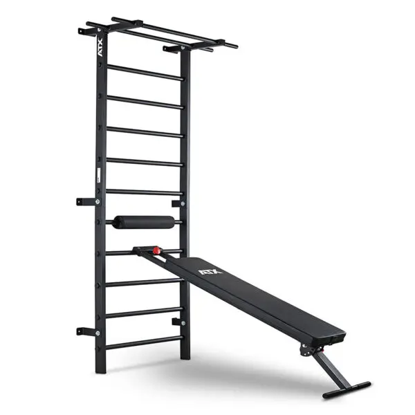 The ATX® Wall Bar Gym is a black wall-mounted setup combining Swedish bars and an angled incline bench with padded support, perfect for strength training exercises.