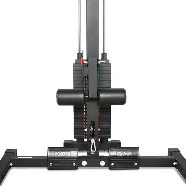 A close-up view of an ATX® HRX-620 Half Rack System Pin Loaded 115 kg shows a weight stack machine with colorful indicators on the plates and a cable attachment. The ATX logo is visible on the metal footrests at the bottom.