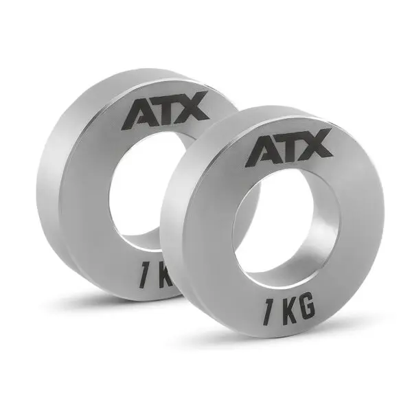 A pair of silver ATX® Olympic Fractional Plate Pairs, each marked 1 KG, stands upright against a white background.