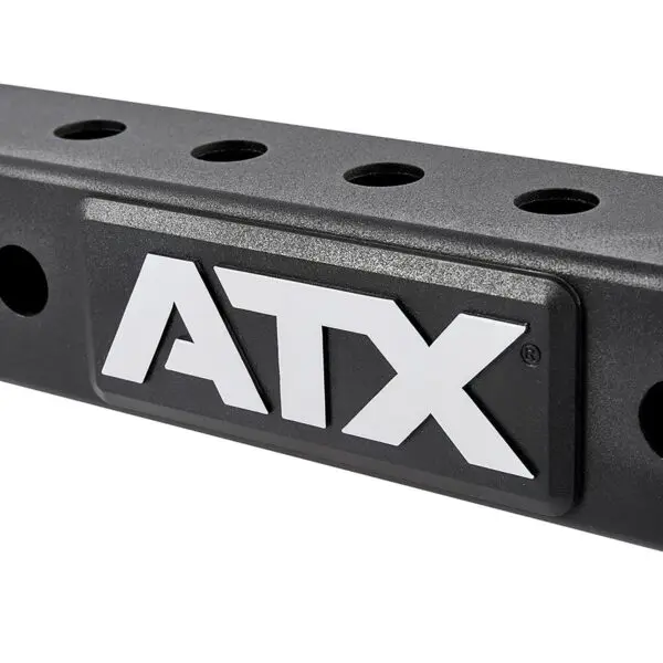 A black metal bar with multiple circular holes and ATX® in bold white letters on a raised rectangular plaque. The surface has a textured finish.