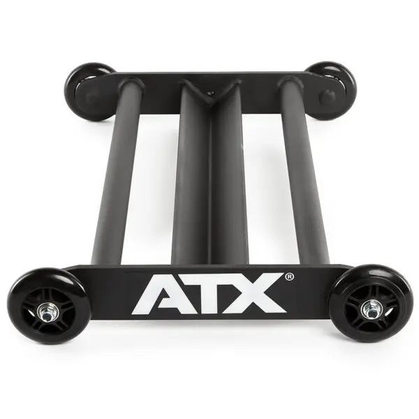 The ATX® Glute Ham Roller, a black device with a rectangular frame and four wheels, is designed to support and transport skateboards. Additionally, it serves as a versatile core hamstring roller for fitness enthusiasts looking to enhance their workout routines.