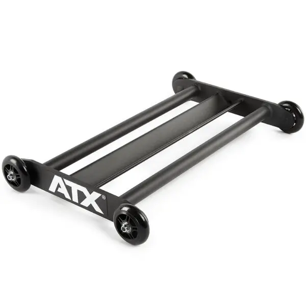 The ATX® Glute Ham Roller is a black roller dolly designed with two parallel bars and four wheels, making it perfect for effortlessly moving heavy gym equipment. Ideal for positioning machines like a GHR machine or core hamstring roller, the ATX logo is prominently displayed on the side.