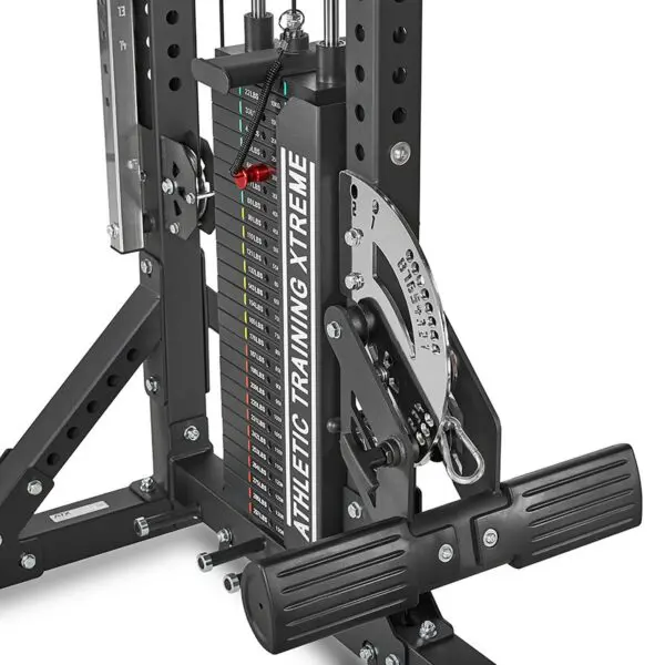 Close-up of the ATX® Trinity Tower 135 kg machines weight stack showcasing its adjustable plates and numbered resistance guide, complete with a visible metal frame and pulley system.