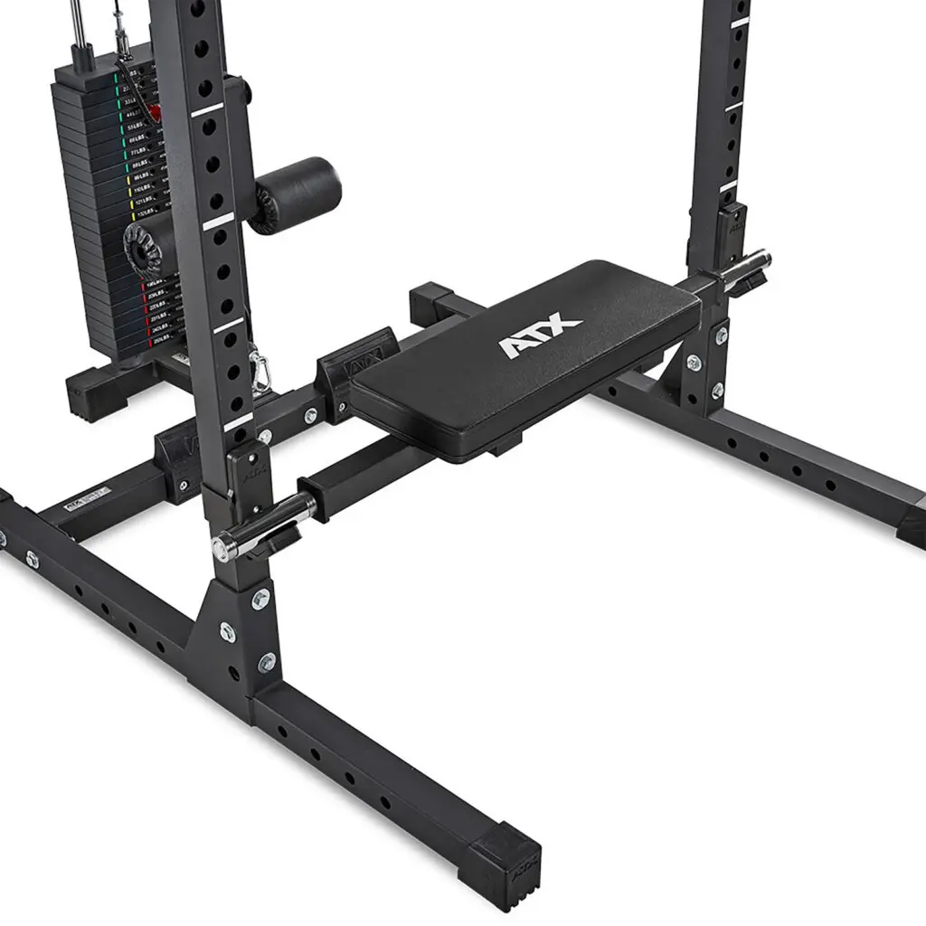 A black, adjustable weight bench with a padded seat connects to a sturdy metal frame, featuring an adjustable pulley and cable weight stack for resistance workouts, enhanced by the ATX® Hip Thruster Attachment for targeted muscle engagement.