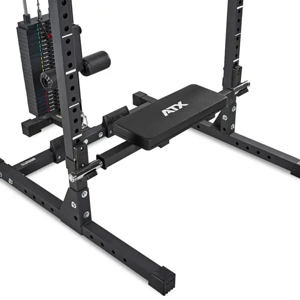 A black, adjustable weight bench with a padded seat connects to a sturdy metal frame, featuring an adjustable pulley and cable weight stack for resistance workouts, enhanced by the ATX® Hip Thruster Attachment for targeted muscle engagement.
