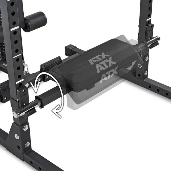 Close-up of an ATX® Hip Thruster Attachment showing its adjustable padded bench with a sliding mechanism, indicated by arrows. The metal frame includes numbered markings for height adjustment.