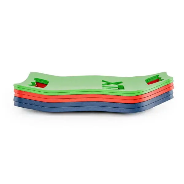 A stack of ATX® Tactical Weight Vests featuring green, red, and blue layers with cut-out hand grips and patterns, placed on a white background.