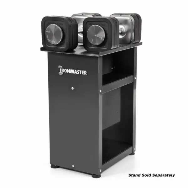 The Ironmaster 75 LB Quick-Lock Adjustable Dumbbell Set prominently rests on a sleek black stand, featuring two shelves and showcasing the brands name, with Stand Sold Separately noted in the bottom right corner.