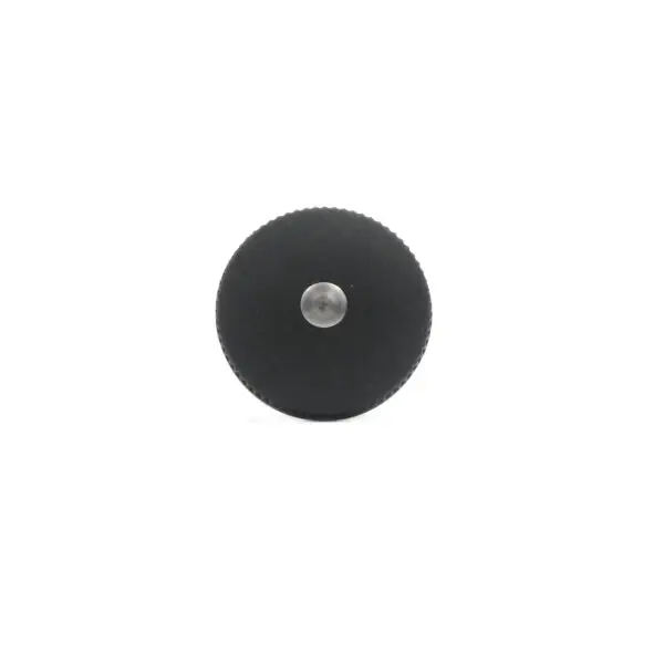 The Pop Pin M12 15mm, featuring a central metallic pin and a textured circular edge, is displayed against a white background.