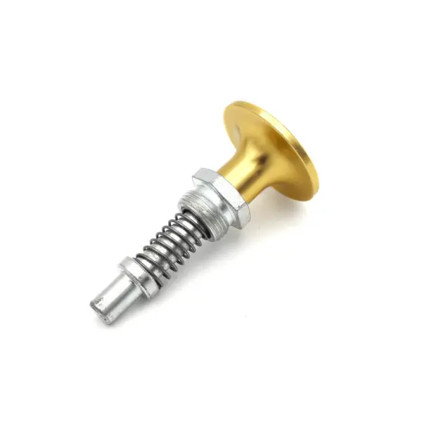 The image displays the Pop Pin M20 6933, a metal mechanical component featuring a gold circular knob, a threaded bolt, and a spring mechanism, slightly angled against a plain white backdrop.