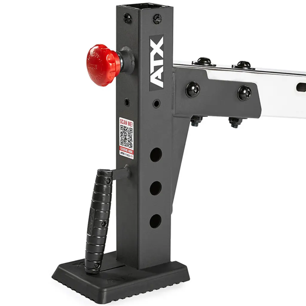 Close-up of a black metal adjustable rack with three circular slots and a red knob, designed for use with an FID bench. It features a textured handle and a QR code on its side. The word ATX is printed vertically on the main structure.