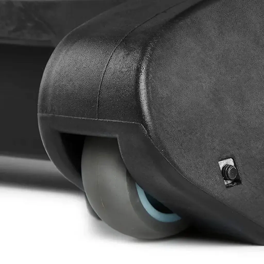 Close-up of a suitcase wheel featuring a sleek, grey caster, echoing the robust design of the ATX® Commercial FID Bench ATX-MBX-660. The wheel is mounted at the corner, displaying its hard plastic casing and a small screw.