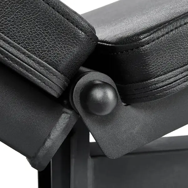 Close-up of the ATX® Commercial FID Bench ATX-MBX-660, a black adjustable flat incline bench with two padded sections connected by a hinge joint. It features a textured, leather-like surface.