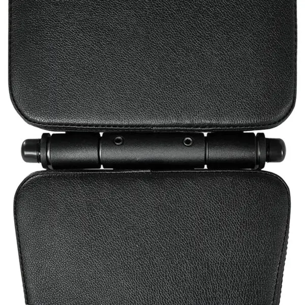 Close-up of a black, textured hinge connecting two padded sections on the ATX® Commercial FID Bench ATX-MBX-660. The hinge features three cylindrical bars and two screws, seamlessly aligning the parts. The material resembles leather or synthetic fabric for durability and style.