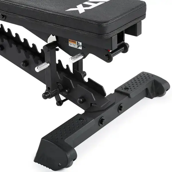 A close-up of the ATX® Commercial FID Bench ATX-MBX-660 reveals its sturdy black metal frame with ridged footrests for versatile workouts. This bench features a padded seat designed for flat and incline exercises with ATX marked in white.