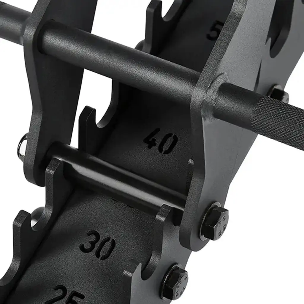 A black adjustable dumbbell set is shown on a rack next to an ATX® Warrior Bench 2.0, with weight increments of 25, 30, and 40. The dumbbell features a textured grip and sits in a metal cradle.