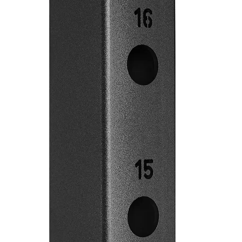Close-up of a smooth, matte black metal structure, part of the ATX® Smith Machine 500 - Low Ceilings - 198 cm, featuring two vertically aligned round holes with 15 and 16 engraved beside them.