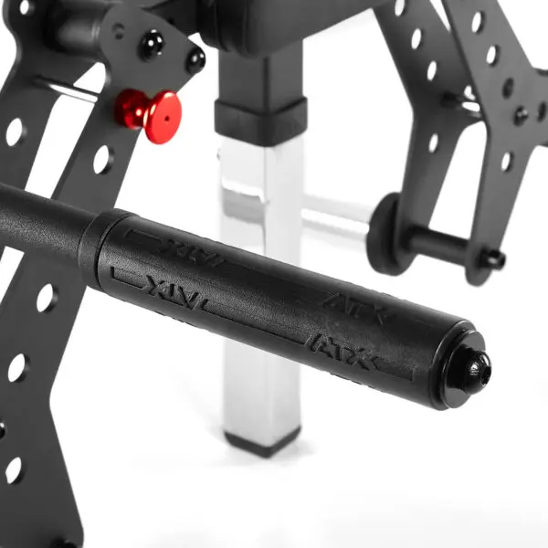 Close-up of the ATX® Pec-Fly Attachment featuring a black frame with a red adjustment knob and padded handlebar. The metallic design is robust with perforated metal for weight customization, and the handlebar showcases the ATX logo.