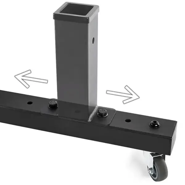 Close-up of an ATX® Attachment Storage Rack, featuring a black metal stand with a square vertical post and a horizontal base on casters. Two arrows indicate adjustment or movement directions.
