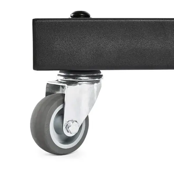 A metal caster wheel is attached to the bottom of the ATX® Attachment Storage Racks black rectangular frame. The gray wheel features a smooth surface and is connected by a metal bracket for rotation and mobility.