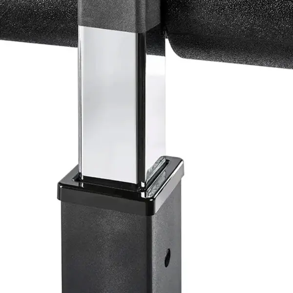 Close-up of the ATX® Attachment Storage Racks adjustable metal pole with a rectangular section, designed for speaker stands. It has a shiny black finish and a locking mechanism, with the background showing another stand part.
