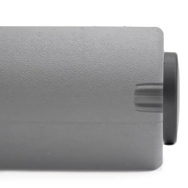 Close-up of a gray Foam Roller Cover 65mm with a textured surface and a black circular end, resembling equipment or machinery part.