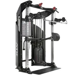 A multi-functional gym machine featuring a cable system with adjustable pulleys, weight stacks, and a chin-up bar. The equipment is black and silver with attachments for various strength training exercises.